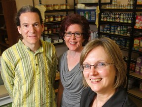 Community Development Council of Quinte staff Jim Mallibar, Bev Heuving and Ruth Ingersoll stand in the agency's new office in Belleville Tuesday. They're celebrating the council's 25th anniversary. 
Luke Hendry/The Intelligencer