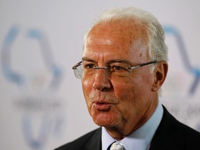 Franz Beckenbauer speaks to journalists after addressing the 123rd International Olympic Committee (IOC) session in the coastal city of Durban, in this July 6, 2011 file picture. (REUTERS/Siphiwe Sibeko/Files)