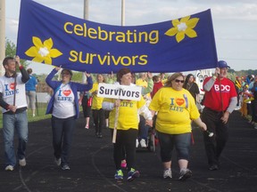 Cancer survivors walk the Survivor Lap at Woodstock's Relay for Life. (File photo)