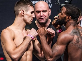 Rory MacDonald (left) and Tyron Woodley (right) square off during UFC 174 official weigh-ins at Rogers Arena in Vancouver on Friday, June 13, 2014. (Carmine Marinelli/QMI Agency)