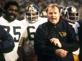 Pittsburgh head coach Chuck Noll with wide receiver coach Lionel Taylor, Hall of Fame defensive tackle Joe Greene and defensive tackle Ernie Holmes, during the closing seconds of the Steelers 16-6 win over the Minnesota Vikings in Super Bowl IX on January 12, 1975 at Tulane Stadium in New Orleans, Louisiana. (Sylvia Allen/NFL)
