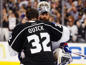 Rangers goalie Henrik Lundqvist and Kings goalie Jonathan Quick embrace after L.A. won the Stanley Cup in Game 5. (Reuters)