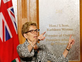 Premier Kathleen Wynne speaks to the media on June 13, 2014. (Michael Peake/Toronto Sun)