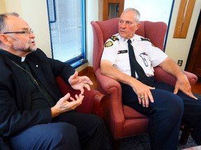 Toronto Police Chief Bill Blair meets at headquarters  on June 11, 2014 with Rev. Brent Hawkes, senior pastor at the Metropolitan Community Church of Toronto and the Grand Marshall of this year’s WorldPride parade. (Dave Abel/Toronto Sun)