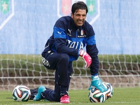 Goalkeeper Gianluigi Buffon is expected to miss Italy's World Cup game against England on Saturday in Manaus, Brazil. (Alessandro Garofalo/Reuters)
