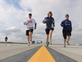 More than 1,400 runners hit the pavement to open the new Calgary International Airport runway on Saturday. (MIKE DREW/QMI Agency)