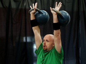 Keith Dosko takes part in a kettlebell sport competition at The Foundry, 4904 - 87 Street, in Edmonton Alta., on Saturday June 14, 2014. David Bloom/Edmonton Sun/QMI Agency