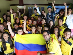 Dozens of Colombian exchange students and their host families descended on Malone's restaurant Saturday, June 14, 2014 for the World Cup match vs. Greece. Restaurant staff divided the place up, with Greece supporters on one side and the screaming kids on the other.  The students return home to Colombia June 18 after spending a month in Ottawa.
DOUG HEMPSTEAD/Ottawa Sun/QMI AGENCY