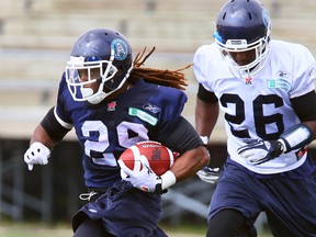 Curtis Steele runs the ball at Argos training camp. (Dave Abel, Toronto Sun)