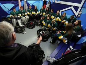 The University Ringette team gets a last minute prep talk before game against the Edmonton Media Team at West Edmonton Mall in Edmonton, AB., on Sunday, Jan 26, 2014. The game is in effort to raise money for the Alberta Cancer Foundation.  Perry Mah/   Edmonton Sun/ QMI Agen