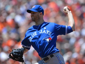 Toronto Blue Jays starting pitcher J.A. Happ releases a pitch during the second inning against the Baltimore Orioles at Oriole Park at Camden Yards on June 15, 2014. (Tommy Gilligan/USA TODAY Sports)