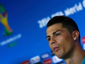 Portugal's national soccer team player Cristiano Ronaldo attends a news conference at the Arena Fonte Nova stadium in Salvador, June 15, 2014. (REUTERS/Marcos Brindicci)