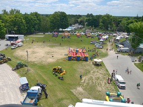 A view of Turtlefest at Memorial Park (about 1 p.m.) showing the Mighty Machines display (on the left), the entertainment stage (top left), the inflatables, Lake Lisgar Water Park (top centre), vendor alley, and behind the Green Palace on the right, the Creative Imagination Festival. CHRIS ABBOTT/TILLSONBURG NEWS
