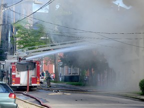 Firefighters battle a blaze at 34 William Street on Sunday, June 15. (FILE PHOTO)