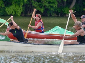 Sharon Puente and Frank Tamasi (foreground) out-paddled Fred and Cassandra Woldenberg in the final 50 metres of their Turtlefest Dragon Canoe Race Saturday morning to win their heat by less than one length. The Woldenbergs had a lead going around the fountain, but lost time making a wide left turn.