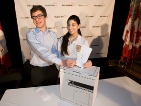 Zane Schwartz of Leaside High School and Olivia Suppa of Jean de Brebuf participate in a student mock election in this file photo. Liberals in Newfoundland and Labrador voted over the weekend in favour of lowering the province's voting age to 16. (Jack Boland / Toronto Sun / QMI Agency)