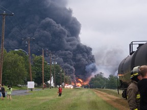 Fire from a train explosion is seen in Lac-Megantic, Quebec on July 6, 2013 after a 72-car runaway freight train carrying crude oil derailed in the centre of the city of resulting in forty-two people confirmed dead with 5 more missing and presumed dead. Roughly half of the downtown area buildings were destroyed. The train was owned by Montreal, Maine and Atlantic Railway Corp (MMA). Steve Poulin/QMI Agency