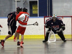 Point Edward Pacers' forward Blair McFarlane fires home a shot past London Blue Devils goalie Chris Brown during their game on Sunday, June 15 at the Point Edward Arena. The Pacers host their last home contest of the season on Saturday, June 21. SHAUN BISSON/ THE OBSERVER/ QMI AGENCY