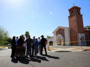 Parishioners arrive to pray, outside the Mater Misericordiae (Mother of Mercy) Mission Catholic church in Phoenix, Arizona June 12, 2014. (REUTERS/Nancy Weichec)
