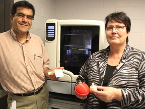 The Bluewater Technology Access Centre's (BTAC) Jafar Arghavani, manager/research engineer, left, and director Maike Luiken, show off some of the products they've created using the centre's 3D printer. The agency is working to create partnerships between Lambton College and local industries. (TYLER KULA/ THE OBSERVER/ QMI AGENCY)
