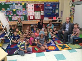 Alberta Education Minister Jeff Johnson, at right, was in Drayton Valley recently touring three local schools one of them being Evergreen Elementary School where he interacted with the Grade 4 class (shown above) who left quite an impression on the Minister.