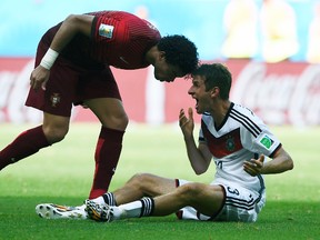 Portugal centre back Pepe headbutts German forward Thomas Muller during their World Cup Group G match at the Fonte Nova Arena in Salvador, Brazil, June 16, 2014. (DYLAN MARTINEZ/Reuters)