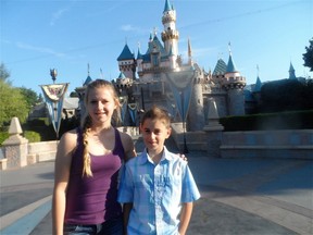 Chantal and Jacob Brodbeck take a photo break in front of Cinderella's Castle at Disneyland in Anaheim, Calif. ANNETTE BRODBECK PHOTO