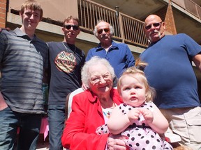 100-year-old Helen Grant holds her great-great-great-great-niece Clairyssa while four other generations of the family look on. From left to right: Derek, Rob, Frank and Jeff Grant. BRENT BOLES / THE OBSERVER / QMI AGENCY