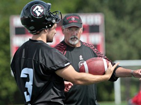 The Ottawa RedBlacks practiced at Keith Harris Stadium on Monday June 16, 2014. Ottawa RedBlack's special teams coach Don Yanowsky is shown here talking to kicker Justin Palardy during practice. 
Tony Caldwell/Ottawa Sun/QMI Agency