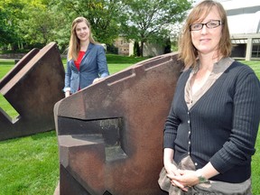 Museum London tour guide Laura Mitrow (left), and curator of public programs, Dianne Pearce, stand next to a sculpture on the front lawn of the museum June 12, 2014. Over the past four years, Museum London has developed in-depth guided tours of London that explore the city’s origins. They continue on Saturday’s throughout the summer. CHRIS MONTANINI\LONDONER\QMI AGENCY