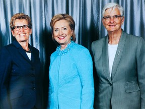 Premier Kathleen Wynne, left, and partner Jane Rounthwaite, right, meet Hillary Clinton in Toronto Monday, June 16, 2014. (Handout)