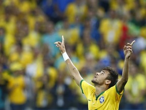 Brazil's Neymar celebrates a goal during the 2014 World Cup opening match between Brazil and Croatia at the Corinthians arena in Sao Paulo June 12, 2014. (REUTERS/Murad Sezer)