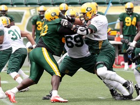 Almondo Sewell, left, was back on the field Monday after missing the first two weeks of camp. (David Bloom, Edmonton Sun)