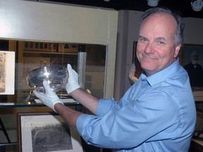 Elgin County Museum curator Mike Baker holds a sterling silver bowl that P.T. Barnum presented to London Zoo director Abraham Bartlett after Barnum bought Jumbo the elephant for his circus. The bowl is part of an exhibit of Jumbo-related items at the museum that runs till July 5. Ben Forrest/Times-Journal