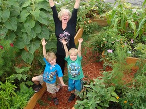 Val Collins stands in the community garden she helped create. Collins is a semifinalist for the Walmart Mom of the Year Award. (Submitted image)