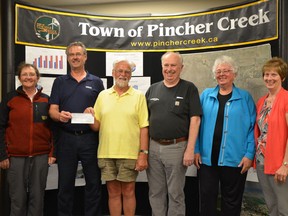The local Communities in Bloom chapter received a $2,500 donation from FortisAlberta's Arbour Day program to plant native trees in a wetlands area. Left to right: Wendy Ryan, Merlin MacNaughton, John Hancock, Don Anderberg, Noreen Robbins, Diane Burt-Stuckey. John Stoesser photo/QMI Agency