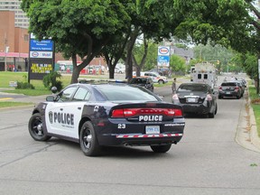 Police vehicles parks along Brock Street in Sarnia where officers were involved in a standoff Tuesday afternoon.
PAUL MORDEN/ THE OBSERVER/ QMI AGENCY