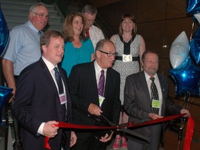 Elgin St. Thomas Public Health held an open house Tuesday to officially open its new building on Talbot St. in St. Thomas. At the ribbon cutting were (front row, from left): Elgin-Middlesex-London MPP Jeff Yurek, past board of health chairman Dave Warden and current board of health chair Jack Couckuyt. Back row: Central Elgin Mayor Bill Walters, health unit executive director Cynthia St. John, Elgin county Warden David Marr and St. Thomas Mayor Heather Jackson. See story Pg. 3. Ben Forrest/Times-Journal