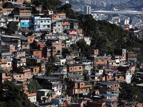 The Maracana Stadium is seen behind a favela in Rio de Janeiro on June 8, 2014. (REUTERS/Eddie Keogh)