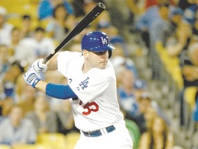 Los Angeles Dodgers center fielder Matt Kemp (27) is congratulated by third base coach Tim Wallach. (Reuters)