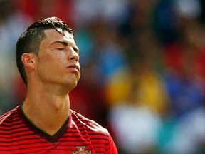 According to reports, Portugal star Cristiano Ronaldo should rest his knee or risk ending his career. (Reuters)