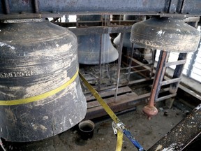 Two large church bells, the same size as others seen in the background, were cut apart so they could be removed from the Trinity Anglican Church belfry. (FILE PHOTO).