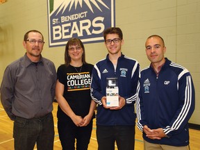 Sudbury Star sports editor Bruce Heidman (left), Cambrian College representative Colleen Heidman and St. Benedict and Cambrian College soccer coach Giuseppe Politi present a GoPro to overall Cambrian College/Sudbury Star High School GameChanger Award winner Shawn Wilcox of St. Benedict on Wednesday.