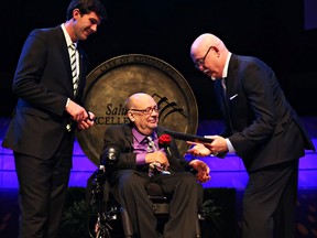 Larry R. Pempeit is recognized by Mayor Don Iveson, left, and councillor Scott McKeen, right, during the Salute to Excellence Hall of Fame induction ceremony.