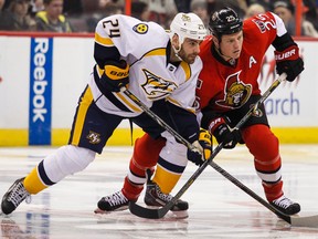 Ottawa Senators' Chris Neil battles with Nashville Predators' Eric Nystrom during NHL hockey action at the Canadian Tire Centre in Ottawa, Ontario on Monday March 10, 2014. Errol McGihon/Ottawa Sun/QMI Agency