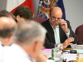 Police services board chair Michael Deeb talks to police chief Brad Duncan during a meeting at police headquarters in London. (Free Press file photo)
