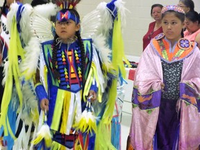 Nine-year-old Cyrus Sinopole, left, and 11-year-old Biidaaske Nahdee were the two head dancers during the mini powwow at Aamjiwnaang First Nation, Wednesday. BRENT BOLES / THE OBSERVER / QMI AGENCY