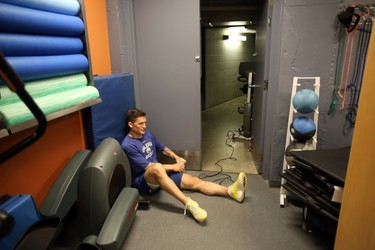 Andrew Ference takes a break at the entrance of the Oilers gym.  Edmonton Oilers started training camp with medicals at Rexall Place in Edmonton, Alberta on Wednesday Sept, 11, 2013. Perry Mah/Edmonton Sun/QMI Agency