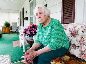 Anne Opfermann sits on the veranda of her Etobicoke home on June 19, 2014. (Stan Behal-Toronto Sun)