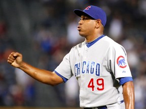 Chicago Cubs relief pitcher Carlos Marmol pumps his fist after their win over the Atlanta Braves in the ninth inning at their MLB National League baseball game at Turner Field in Atlanta, Georgia  August 13, 2011. (REUTERS/Tami Chappell)